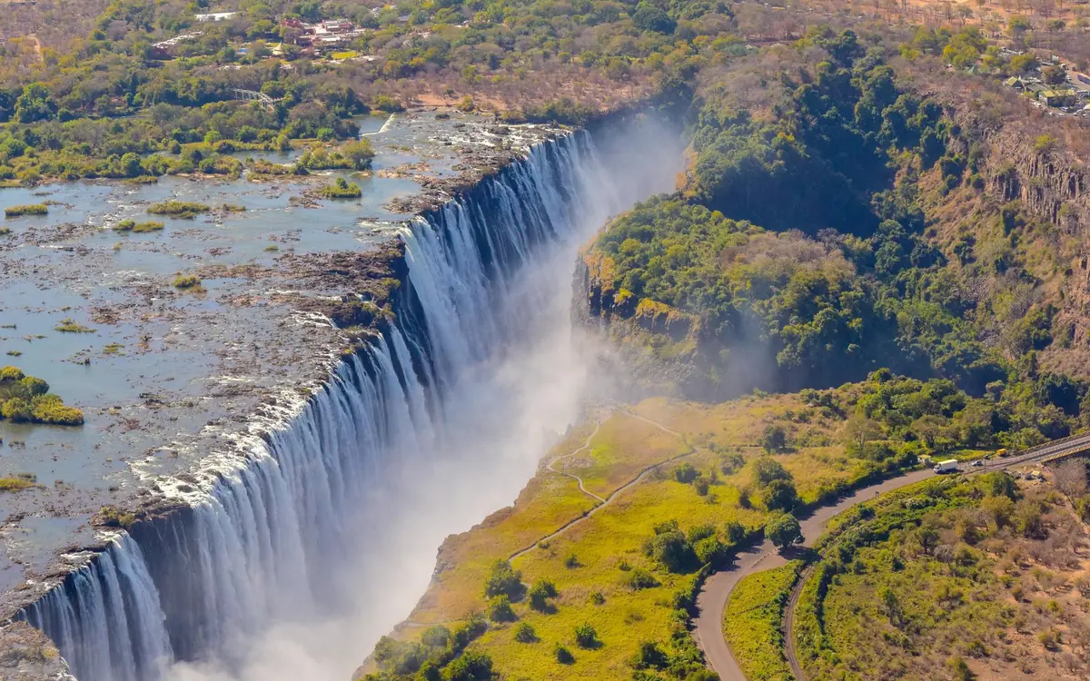 A helicopter on the helipad outside Victoria Falls before a scenic flight