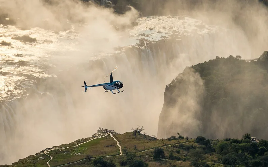 A helicopter over Victoria Falls from the Zambian side at Livingstone