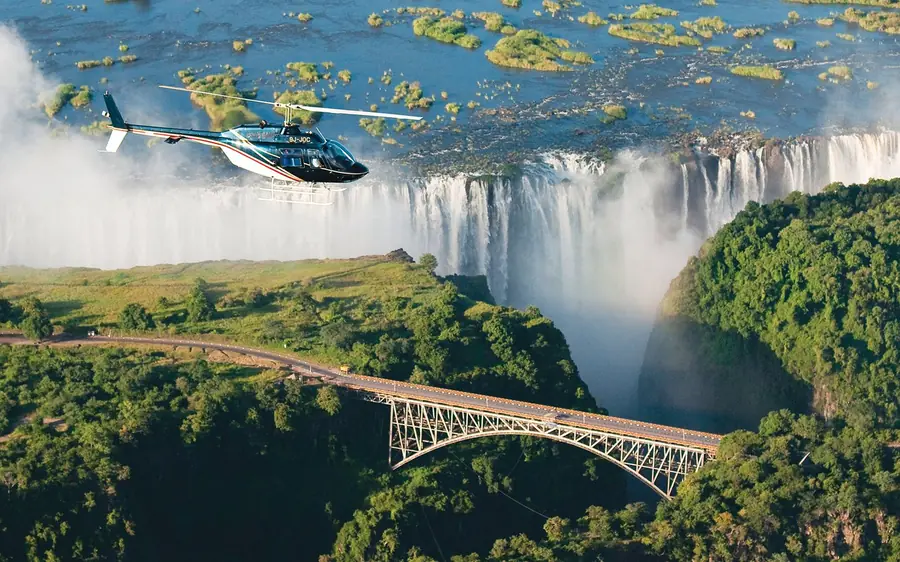 Victoria Falls and its rainbow seen from a scenic helicopter flight